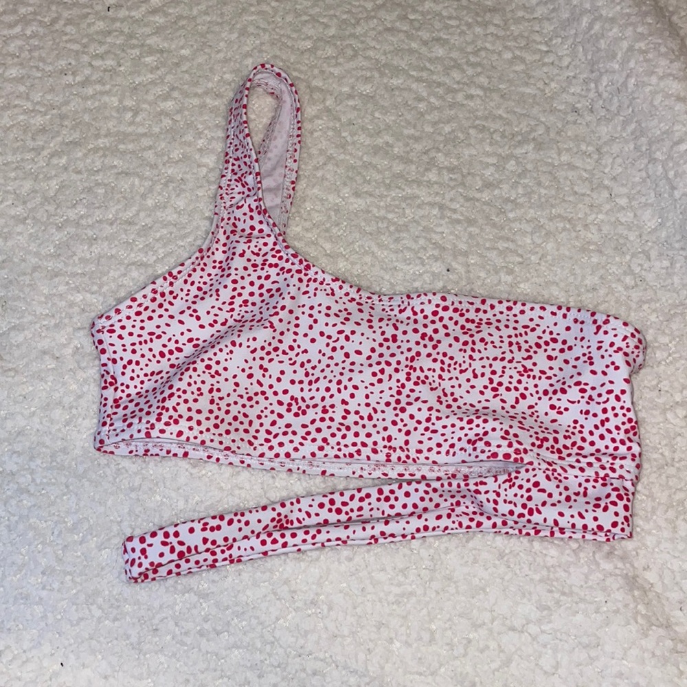 pink and white one shoulder swim top